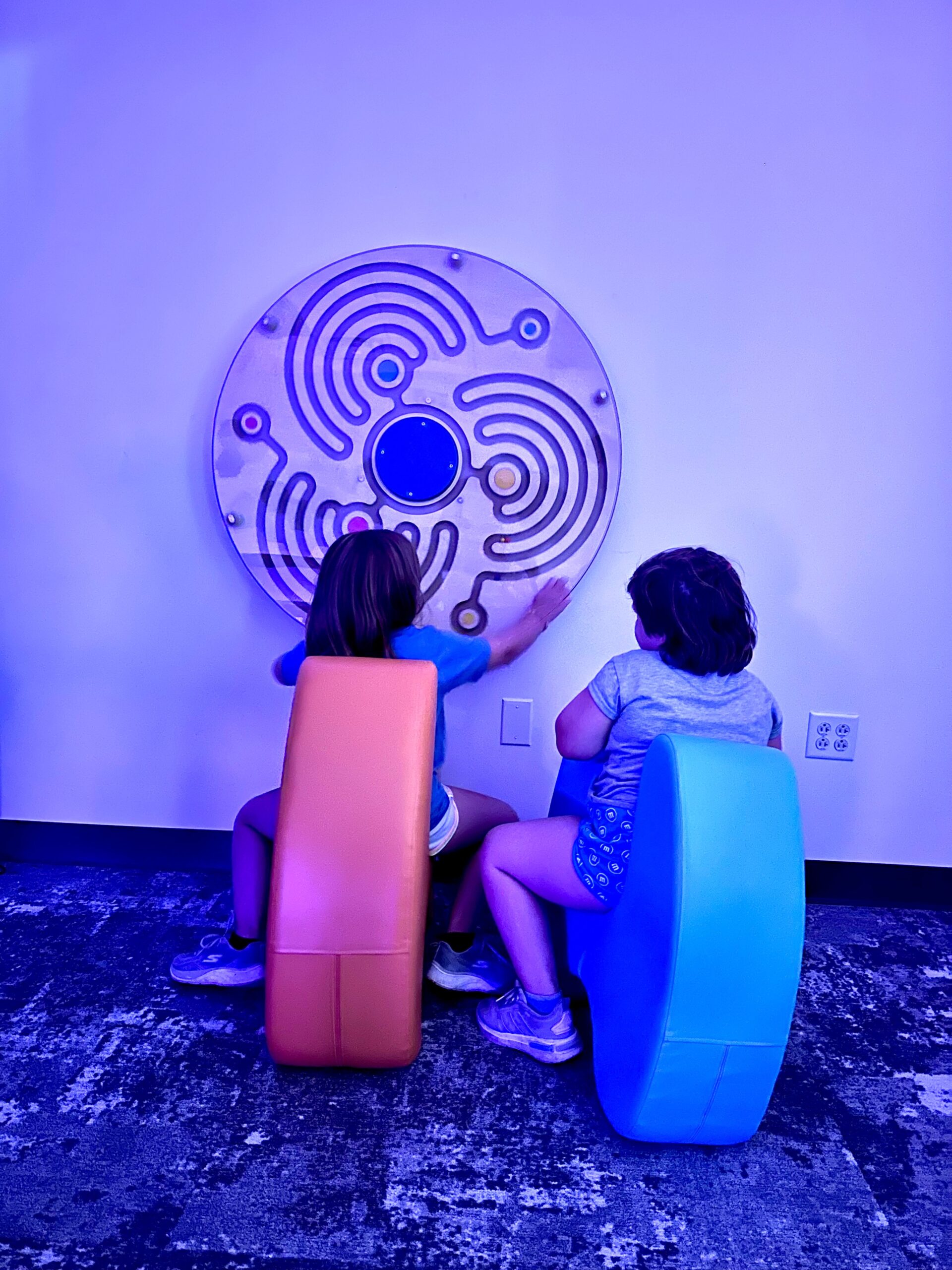 Kim's neices using wall labyrinth in Sensory Room